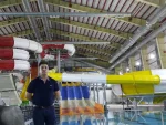 Indoor water park design with colorful water slides under a covered roof